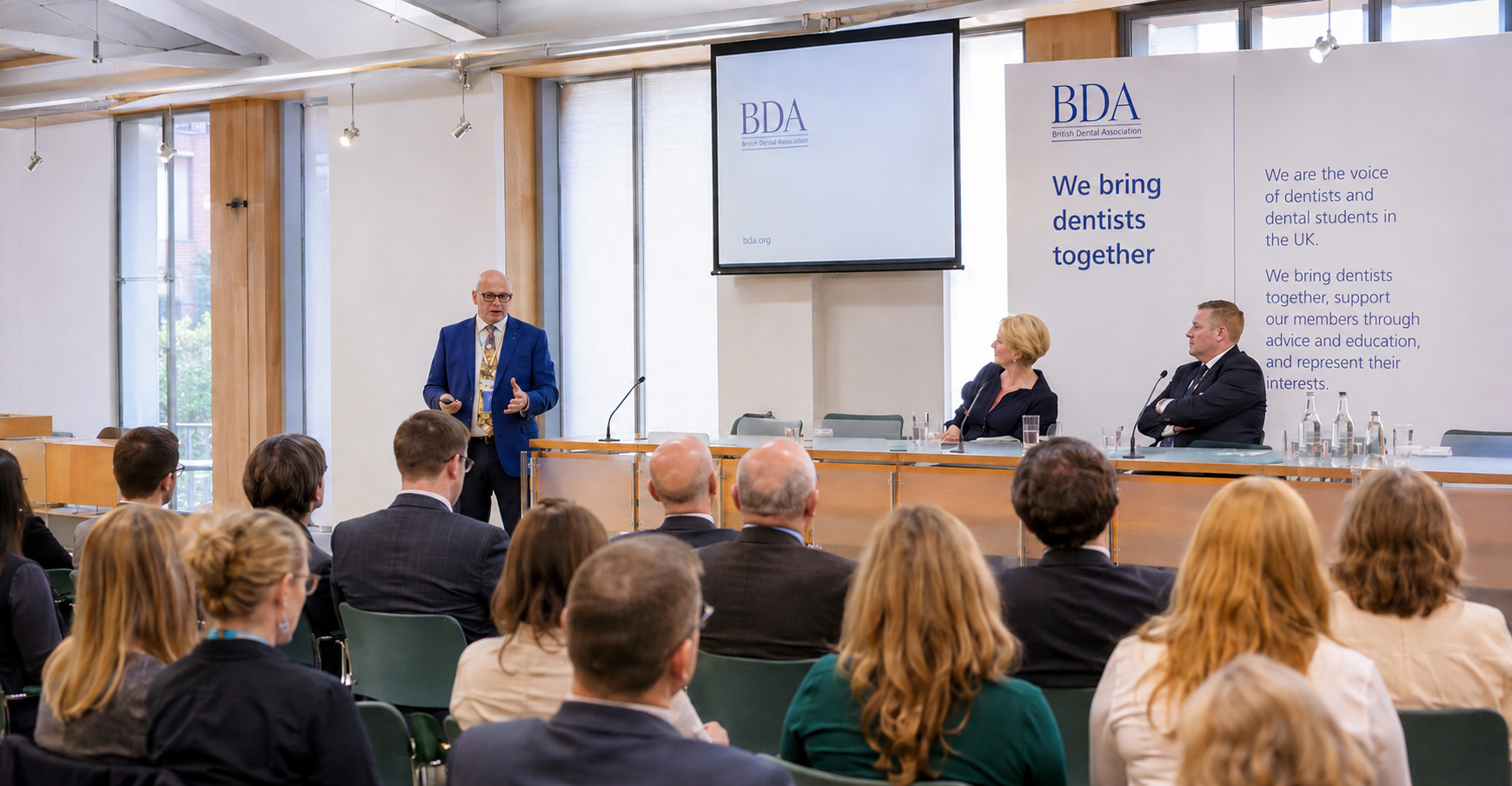 British Dental Association conference presentation with audience