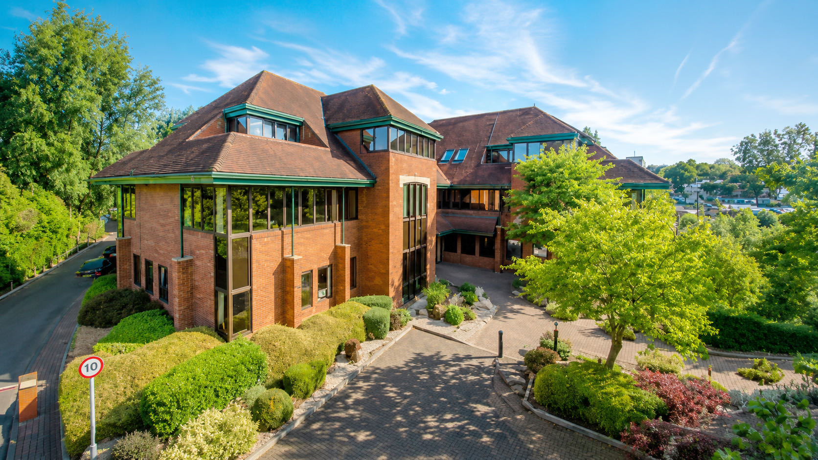 Brick office building with landscaped grounds