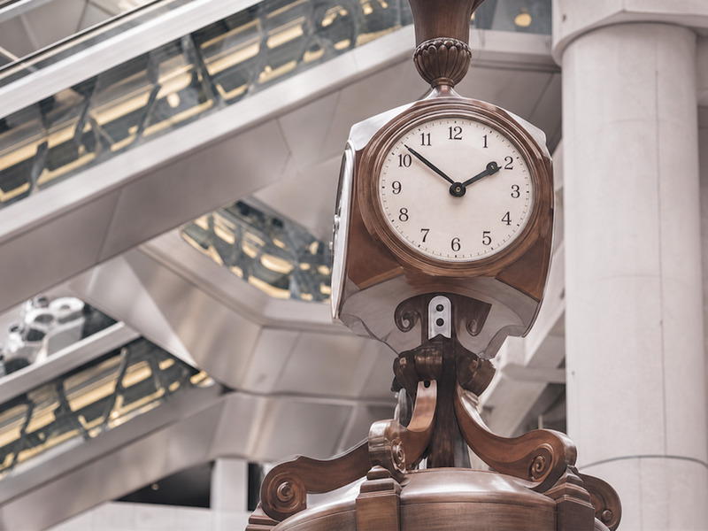 Hanging clock detail inside a London atrium